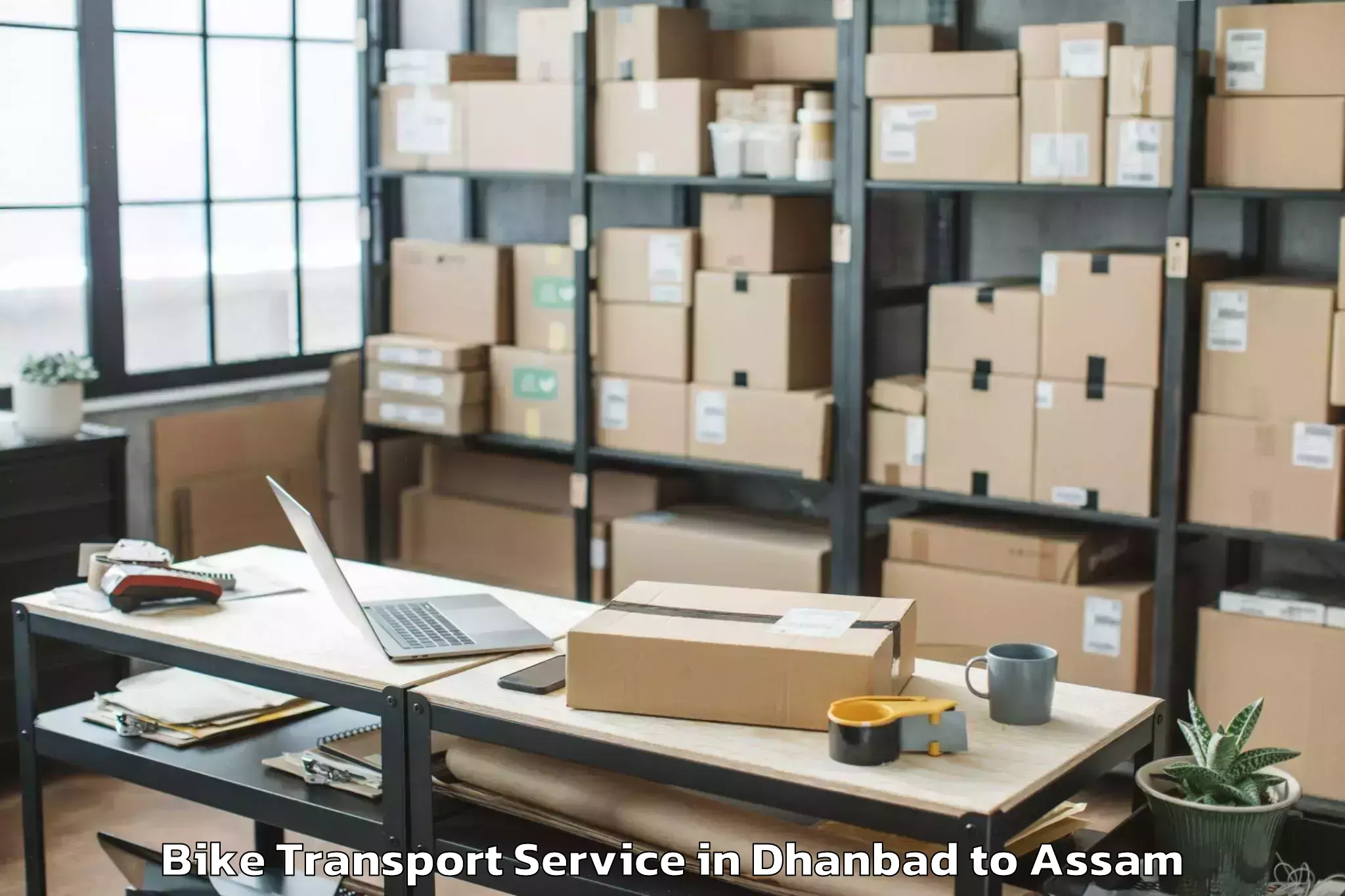 Book Dhanbad to Bhergaon Bike Transport